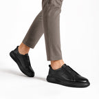 Slip-On Noir – vue profil fond blanc